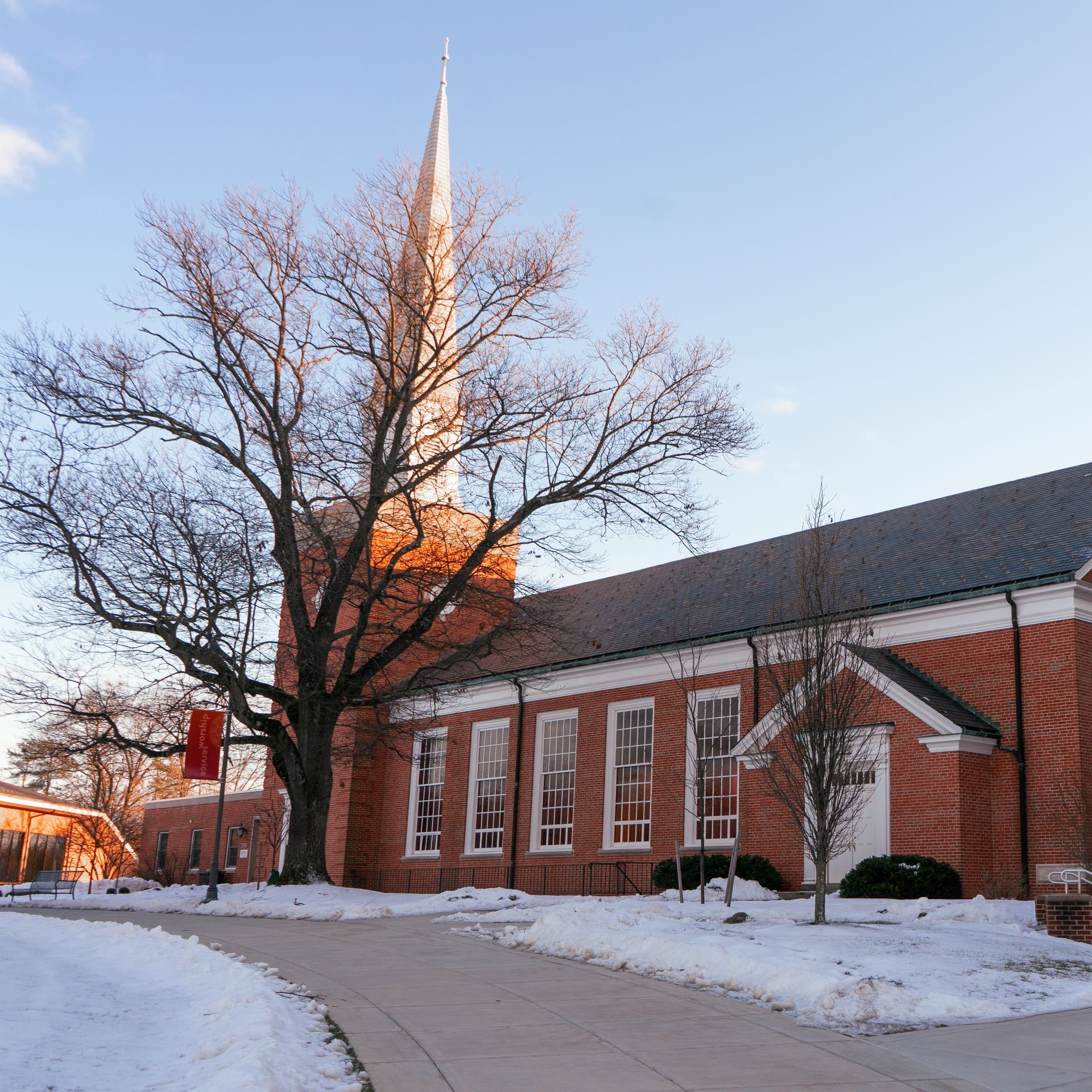 snow on the ground on a bright, sunny day outside Hostetter Chapel